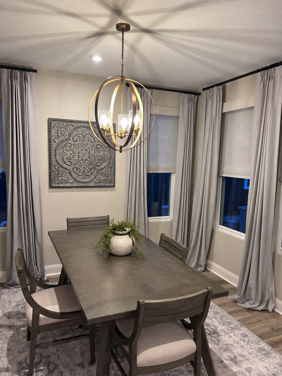 Finished Kichler chandelier installed by FLEX it above a dining table